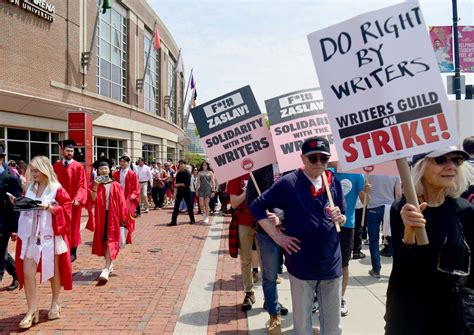 Hundreds join Writers Guild in picketing Warner Bros. CEO commencement speech at BU